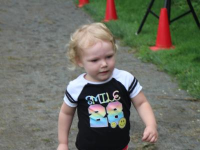 Photo of a child running the fun run 5 k